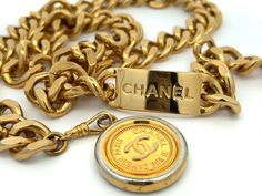 CHANEL Vintage Medallion Coin Chain Belt Vintage Gold Necklace With Gold-tone Logo Plaque, Vintage Jewelry With Gold-tone Logo Plaque, Vintage Necklace With Logo Charm For Formal Occasions, Vintage Gold-tone Necklace With Logo Charm, Vintage Gold-tone Jewelry With Logo Charm, Luxury Gold Metal Chain Belt, Elegant Gold Jewelry With Logo Plaque, Elegant Gold Jewelry With Metal Logo, Formal Gold Jewelry With Metal Logo