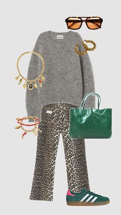 a woman in leopard print pants and sweater with sunglasses on her head, holding a green purse