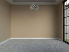 an empty room with a large window and a light fixture hanging from the ceiling in front of it