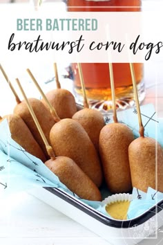 beer battered bratwurst corn dogs on a tray with toothpicks