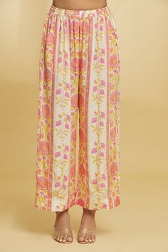 Powder yellow and pink kurta with floral pattern, gota emboidery and tassel details. Paired with a matching pant. - Aza Fashions Pink Block Print Sets For Spring, Pink Floral Print Palazzo Set For Festivals, Traditional Floral Print Bottoms For Spring, Spring Pink Block Print Sets, Spring Block Print Pink Sets, Traditional Spring Floral Print Bottoms, Pink Floral Print Palazzo Set For Navratri, Pink Bohemian Palazzo Set With Printed Motifs, Multicolor Festive Bottoms For Spring