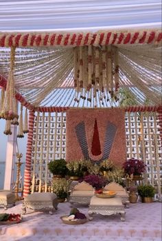 an outdoor wedding setup with flowers and decorations