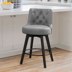 a gray bar stool in a white kitchen