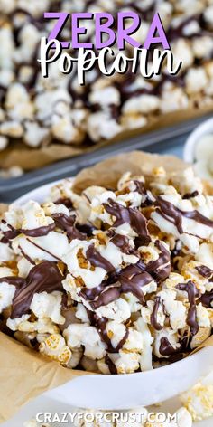 a white plate topped with popcorn covered in chocolate