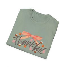 This girly coquette Thanksgiving Fall T-Shirt exudes a warm and festive vibe, perfect for celebrating the autumn season. It is relevant to those who enjoy expressing their love for fall holidays and festivities. Product features - Made from 100% ring-spun cotton for a lightweight and comfortable feel - Classic fit with crew neckline for versatile styling - Ethically grown and harvested US cotton for sustainability - Features ribbed knit collar and shoulder tape for durability - Perfect for printing with specially spun fibers for smooth fabric Care instructions - Do not dryclean - Machine wash: warm (max 40C or 105F) - Do not bleach - Tumble dry: low heat - Iron, steam or dry: low heat Green Tops For Fall Holiday, Casual Fall Holiday T-shirt, Casual T-shirt For Fall Holiday, Cute Fall T-shirt For Gift, Holiday Crew Neck Tops For Fall, Cotton T-shirt For Fall Holiday, Fall Short Sleeve Tops For Gift, Fall Short Sleeve Tops For Gifts, Short Sleeve Tops For Fall Gift