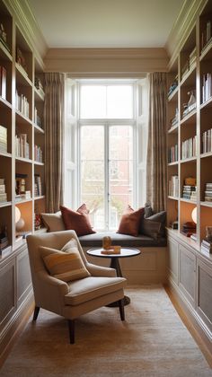 a living room filled with lots of furniture and bookshelves next to a window