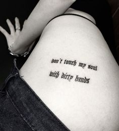 a woman with a tattoo saying don't touch my soul, only dirty hands