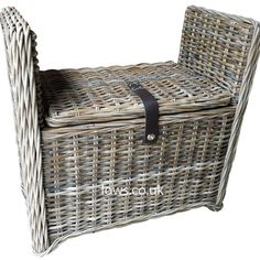 an empty wicker basket with leather straps