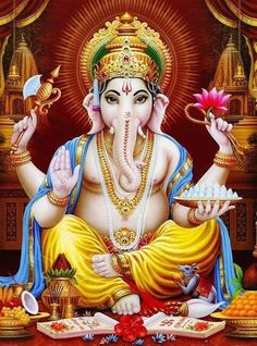 lord ganesha sitting on the ground holding a plate