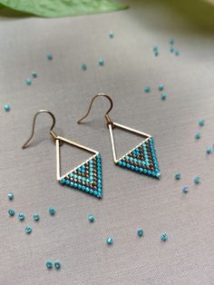 Dive into the bliss of summer with our 'Aegean Breeze Triangle Earrings'. Handcrafted with love and precision, each earring features a Stainless Steel Gold link that anchors a refreshing blend of turquoise blue, aqua blue, and bronze Miyuki beads. Utilizing the ancient technique of bead weaving, specifically brick stitch, this design mirrors the allure of ocean waves and the warmth of summer skies. Mirroring the allure of ocean waves and the warmth of summer skies these triangle earrings elevate Summer Beaded Jewelry For Everyday, Summer Beaded Everyday Jewelry, Summer Everyday Beaded Jewelry, Everyday Summer Beaded Jewelry, Minimalist Tiny Beads Jewelry For Summer, Minimalist Beach Jewelry With Ear Wire, Minimalist Tiny Beads Summer Jewelry, Minimalist Earrings For Summer, Sterling Silver Earrings For Everyday Summer Wear