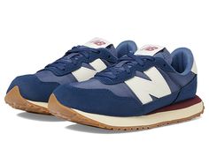 New Balance Kids 237 (Big Kid) - Boy's Shoes : NB Navy/Turtledove : Run and have fun wearing New Balance Kids footwear. Leather and textile upper. Textile lining. Removable textile insole. Sewn logo patch with iconic brand marking along tongue. Lace up closure. Round toe. Synthetic sole. Imported. Measurements: Weight: 7 oz Product measurements were taken using size 3.5 Big Kid, width W. Please note that measurements may vary by size. New Balance Sneaker, Boys Shoes, Big Kids, Kid Shoes, New Balance, Patch Logo, Shoes Sneakers, Lace Up, Running