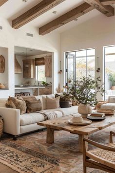 a living room filled with furniture and lots of windows