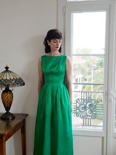 Another lovely dress that I'm letting go of. This lovely emerald green 1950s gown was purchased with some damage to the front, which is still there. It's still wonderful for photos, as you can Photoshop it, but it may be noticeable in person. There is a large scratch across the front and some other minor discolourations. The zipper is also in need of repair. Below are approximate measurements: Waist: Approximately 26 inches Bust approximately 36 inches Length from shoulder to hem about 53.5 inches If you have any questions, feel free to ask! Thank you. 1950s Gown, Satin Evening Gown, 1950s Dress, Green Satin, Lovely Dresses, Dress Clothes For Women, Evening Gown, Emerald Green, Evening Gowns