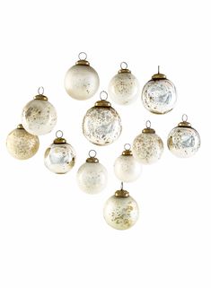 twelve glass bauble ornaments in various sizes and colors are shown on a white background