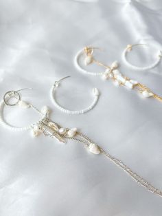 The Sweet Serenade earrings are these beautiful asymmetrical earrings that have the most beautiful pearls and shells hung on a beaded hoop! Permanent Jewelry, Asymmetrical Earrings, Honolulu Hawaii, Retail Therapy, Honolulu, The Sweet, Infinity Bracelet, Timeless Design