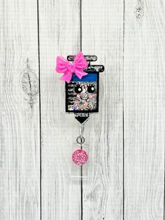 "Syringe Badge Reel. This badge reel will make the perfect addition to your badge collection. Great badge for phlebotomist, infusion nurses and more. You can use these to hold your name tag, badge, or key card. All badge reels are made using a 2\" acrylic. They are designed using vinyl, glitter, and sealed with UV resin. *Acrylics are attached using a swivel alligator clip. Belt Clips are available upon request. You may request them in the notes to seller at checkout. *Make Your Badge Interchang Phlebotomy Badge Reel, Nursing School Supplies, Nurse Crafts, Badge Reels Diy, Nursing Things, Diy Resin Keychain, Belt Clips, Resin Pens, Badge Accessories