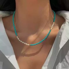 This delicate necklace brings together the serenity of turquoise beads with the subtle shimmer of moonstone. Each piece is meticulously crafted with natural freshwater pearls and blue turquoise accents, offering a unique combination of textures and colors. The adjustable chain ensures a comfortable fit, making this necklace perfect for layering or wearing on its own for a minimalist, chic look. Details Material: 24K gold-plated brass, natural freshwater pearls, turquoise, and moonstone Length: 46cm, 47cm, 46cm (with 5.5cm extension) Weight: Approx. 5.3g, 7.0g, 8.0g Style: Elegant and versatile, perfect for both casual and formal occasions Care Tips: Avoid exposure to harsh chemicals and keep dry to maintain its beauty Missy Jewelry Natural Stone Necklace Collection Turquoise Accents, Natural Stones Necklace, Turquoise Bead Necklaces, Pearl Jewelry Necklace, Gold Statement Earrings, Natural Stone Bracelets, Natural Stone Jewelry, Cord Necklace, Anklet Jewelry