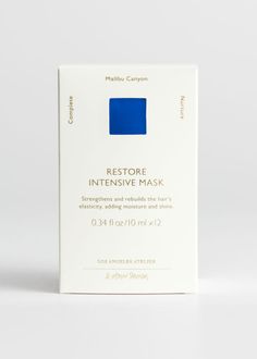 the front of a white box with blue squares on it that says restore intensive mask