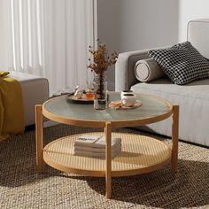 a living room scene with focus on the coffee table and sofa in the foreground