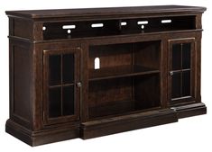 a wooden entertainment center with glass doors and shelves on both sides, in dark brown finish