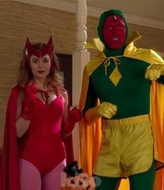 two people in costumes standing next to each other