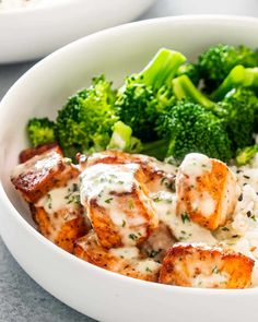 a white bowl filled with broccoli and chicken