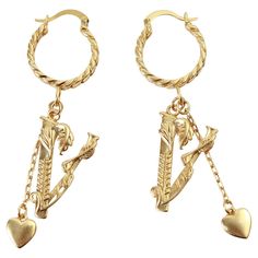 Vintage Versace Gold Tone Dangling Pieces Hoop Earring Circa 2000s. These great earrings have a small hoop with a long dangling V. A vine wrapped around it has a flower on one end and leaves on the other, all going up the V. There is also a very thin chain dangling with a heart hanging. They are so chic and so well thought out. They are pierced. Versace Gold, Vintage Versace, Atelier Versace, A Flower, Jewelry Earrings Dangle, Versace, Gold Tones, Dangle Earrings, Jewelry Earrings