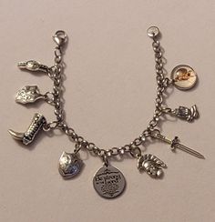 Silver Armor of God Chain Bracelet comes with all charms shown in the first picture.  Bracelet is 7.5 inches long, however we can make any size you need.  Just note the size you need in the message to seller when placing your order and we will follow your directions.  Please feel free to message us with any questions you may have. Thank you so much. Metal Charms With Lobster Clasp For Collectors, Nickel Free Charm Bracelet As Collectible, Metal Themed Bracelet Jewelry, Themed Bracelet With Lobster Clasp, Themed Jewelry With Lobster Clasp, Collectible Metal Charm Bracelet With Lobster Clasp, Themed Charm Bracelet Jewelry, Themed Silver Bracelets With Charms, Themed Metal Bracelets With Charms