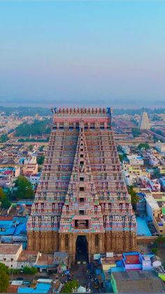 an aerial view of a temple in india with the surrounding buildings and streets around it