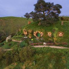 an aerial view of a hobbot house in the hills