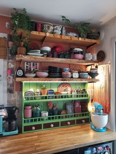 a shelf filled with lots of plates and bowls