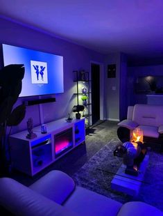 a living room filled with furniture and a flat screen tv mounted to the side of a wall