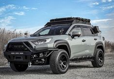 the toyota pickup truck is parked on gravel