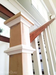 a close up of a wooden stair rail