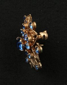 "Cobalt Floral Pin Gold Tone Filigree, Bright Blue Prong Set Rhinestone Floral Brooch, Excellent Condition, 1-3/8\" Diameter, Riveted Construction. Openwork Blue Rhinestones Flower Circle Brooch. This is a multi dimensional Art Deco Brooch full of beautiful detail and oh so sparkly. A great example of Mid Century Design. Clean and ready to wear or gift. c. 1950's Please read all descriptions and view all photos carefully. Please feel free to ask any questions that are not addressed on my policy Blue Costume Jewelry Brooch For Wedding, Blue Victorian Brooch For Formal Occasions, Victorian Blue Brooch For Formal Occasions, Blue Victorian Brooches For Formal Occasions, Dimensional Art, Art Deco Brooch, Flower Circle, Floral Pins, Floral Brooch