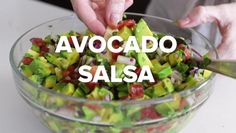 someone is adding avocado to a salad in a glass bowl with the words, avocado salsa