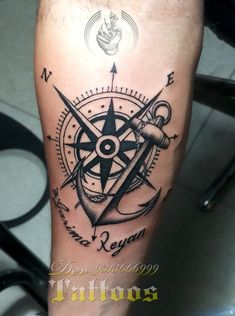 a man with a compass tattoo on his leg