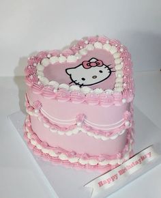 a hello kitty birthday cake with pink frosting