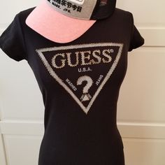 Brand: Guess Size: Xs Color: Black Shimmering Beads Adorn Our Iconic Logo In This Need-Now Knit Tee. Super-Stretch Knit Tee. Rounded Neckline. Short Sleeves. Beaded Triangle Logo At Front Made Of Cotton And Spandex Hand Wash **Only Guess Tee For Sale, Hat Is Not Included In The Listing** Fitted Crew Neck T-shirt With Sequins, Fitted Sequin Crew Neck T-shirt, Casual Embellished T-shirt, Fitted Casual Top With Rhinestones, Fitted Casual Tops With Rhinestones, Casual Fitted Tops With Rhinestones, Casual Rhinestone Tops For Night Out, Black Crew Neck Top With Sequins, Black Sequined Crew Neck Top