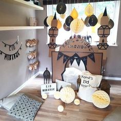 a room filled with lots of decorations on top of a hard wood floor next to a window