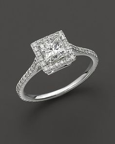 a square diamond ring with pave set shoulders