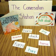 some signs on a table with animals and words