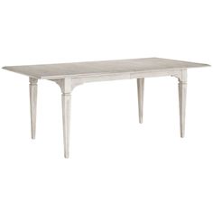 a white table with two legs and a long wooden dining room table in the middle