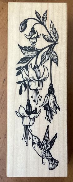 a rubber stamp with flowers and birds on it