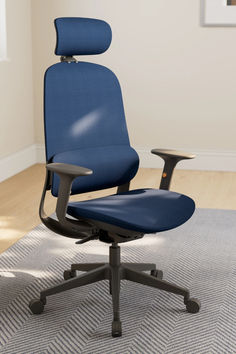 a blue office chair sitting on top of a rug