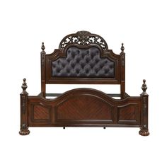 the headboard and foot board are made upholstered with an intricately carved design