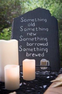 some candles are sitting on a table next to a sign that says something old and something new