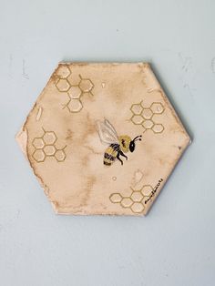 a honeycomb with a bee painted on it