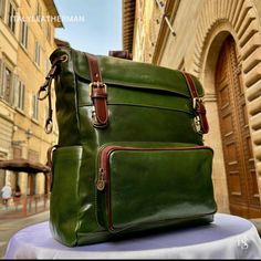 This Italian leather Backpack is a true masterpiece of craftsmanship. Handmade in Florence, Italy, it combines luxurious materials and exquisite attention to detail. Elevate your style and travel in sophistication with this elegant backpack. . Size: Height 45cm/17.8inch Width 36cm/14.2inch Depth 24cm/6-7 inch Color: Green . The story of this backpack: In the picturesque city of Florence, renowned for its rich history and exquisite craftsmanship, there existed a small leather workshop tucked away Elegant Backpack, Elegant Backpacks, Handmade Leather Backpack, Italian Leather Bags, Leather Backpacks, Leather Workshop, Leather Travel, Handcrafted Leather, Travel Companion