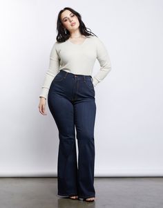 Take a trip to the past in our Curve 70s Girl Flared Jeans! Features a high-waisted cut that hugs the waist perfectly, a simple dark blue wash, and bell bottoms. These jeans are made from 49% rayon, 32% cotton, 17% polyester, and 2% spandex. Made in the USA. Model is 5'6", bust 40", waist 29", hips 45" and is wearing a size 1XL. Curvy Flare Jeans, Plus Size Bottoms, Mid Size Flare Jeans Outfits, High Rise Jeans Outfit Curvy, Flare Jeans Plus Size Outfit, Plus Size Vaquera Outfit, Outfits For Petite Curvy Women, Plus Size Flare Jeans Outfits, Flared Jeans Plus Size